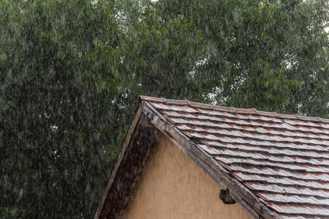 May downpour falls on a tiled roof