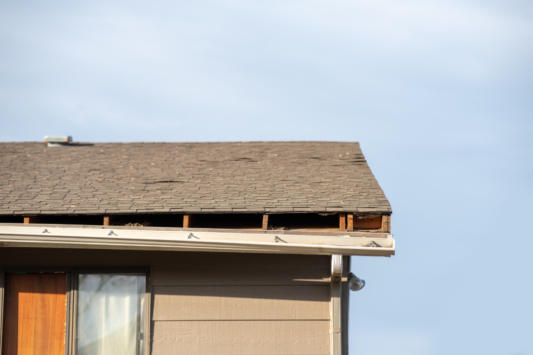 rain gutter on apartment detaching from roof