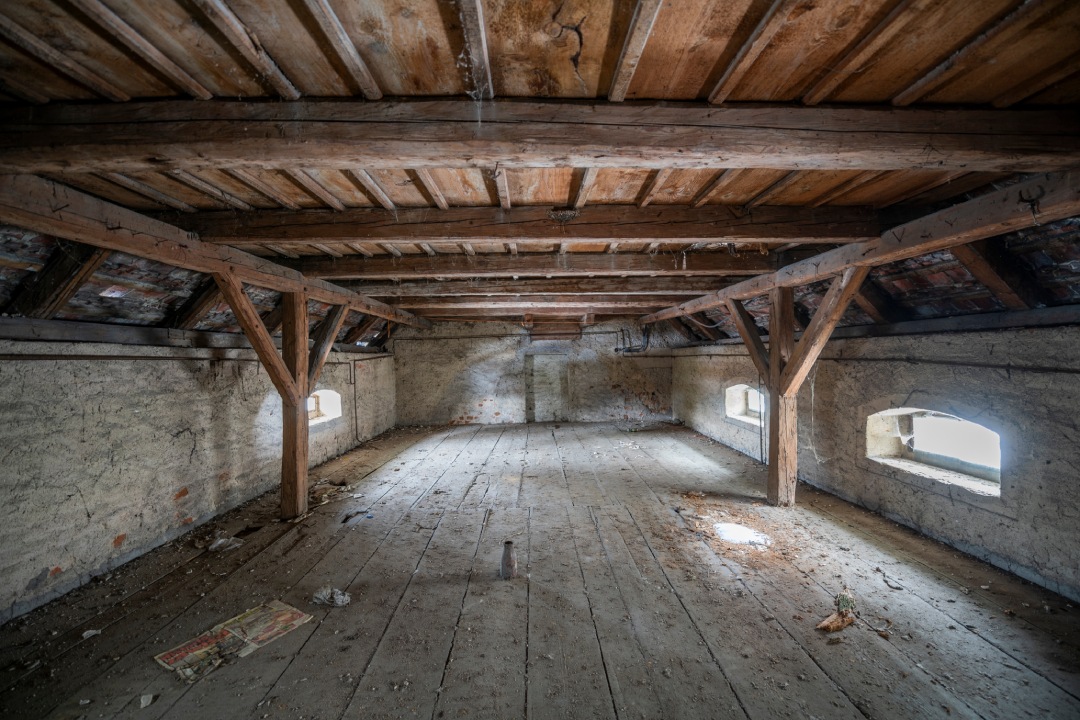 Exploration of the historic old stone mill with a spiral staircase in Southern Poland, Europe, in Winter